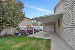 View of RV/car parking area featuring an attached carport