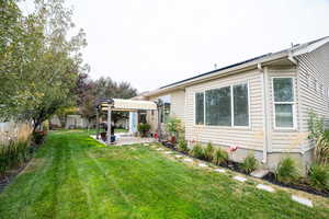 Back of house with a patio area, fenced backyard