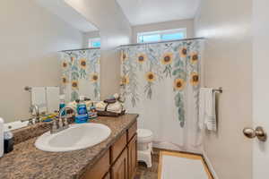Hall Bathroom featuring vanity and shower / tub combo