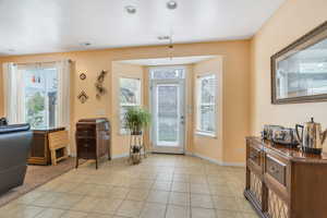 Nook with plenty of natural light and light tile patterned floors
