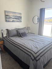 Bedroom with dark carpet