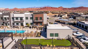 Aerial view of residential area featuring a mountainous background