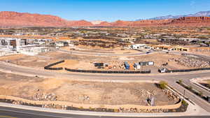 Aerial perspective of suburban area featuring a mountainous background