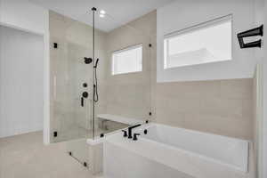 Bathroom with a shower stall, a bath, tile patterned floors, and recessed lighting
