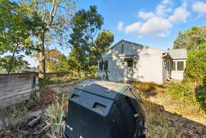 View of property exterior featuring brick siding