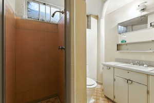 Bathroom with a stall shower and vanity