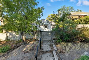 View of front of house featuring a gate and driveway