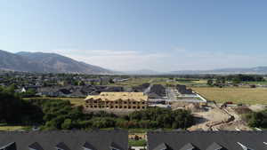 View of mountain background featuring nearby suburban area