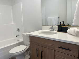 Bathroom featuring shower / bathtub combination and vanity
