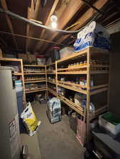 Storage area featuring water heater