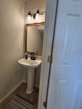 Bathroom with tile patterned flooring and baseboards