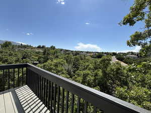Deck with view of wooded area