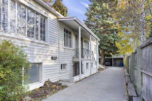 View of property exterior with an outbuilding