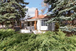 Rear view of house with a chimney