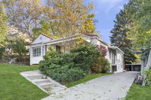 View of property exterior with a lawn