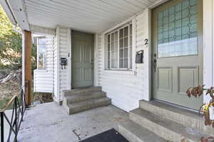 Entrance to property with covered porch