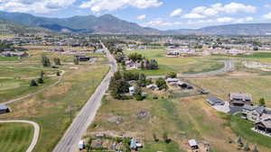 Aerial view of property's location with mountains and rural landscape