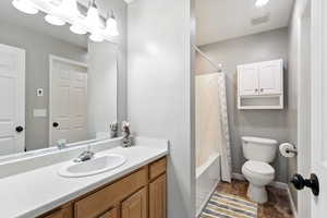 Full bath with shower / bathtub combination with curtain and vanity
