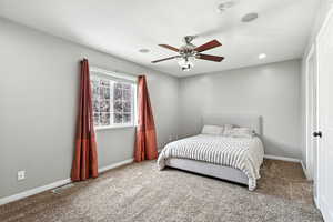 Bedroom featuring carpet floors, ceiling fan, and recessed lighting