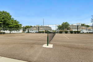 View of tennis court with community basketball court