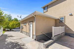 View of side of home featuring stucco siding