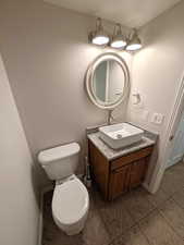 Bathroom with vanity and light tile patterned flooring