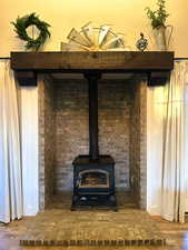 Detailed view of a wood stove and wood finished floors