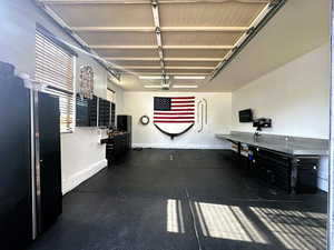 Garage featuring baseboards