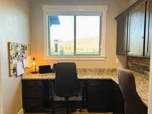 Office area featuring a mountain view and built in desk