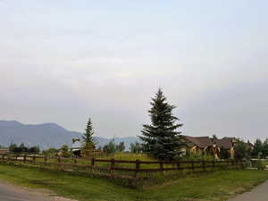 View of asphalt road with a view of countryside and a mountain view