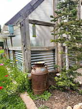View of home's exterior with an outdoor structure