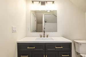 Full bath with vanity and a tile shower
