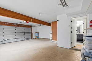 Garage featuring a garage door opener