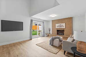 Living area featuring a fireplace and light wood finished floors