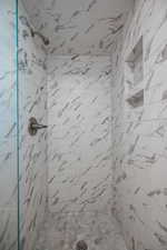 Bathroom featuring a shower stall