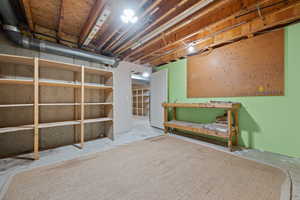 Unfinished basement with a workshop area