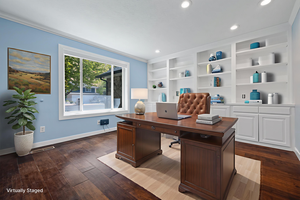 Office space featuring dark wood-style floors, ornamental molding, recessed lighting, and built in shelves