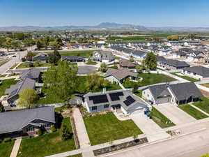 Aerial view of residential area featuring a mountain backdrop