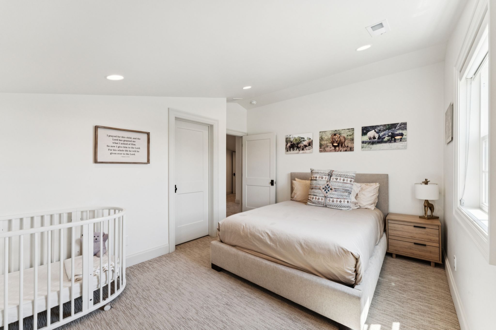 Bedroom featuring a nursery area, carpet flooring, and recessed lighting