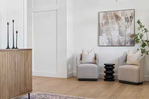 Living area with light wood-type flooring and baseboards