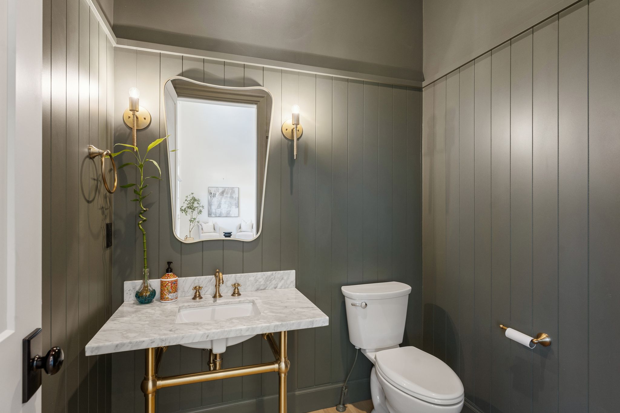 Half bath with a sink and toilet