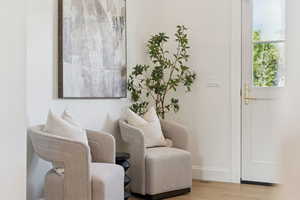 Sitting room featuring wood finished floors and baseboards