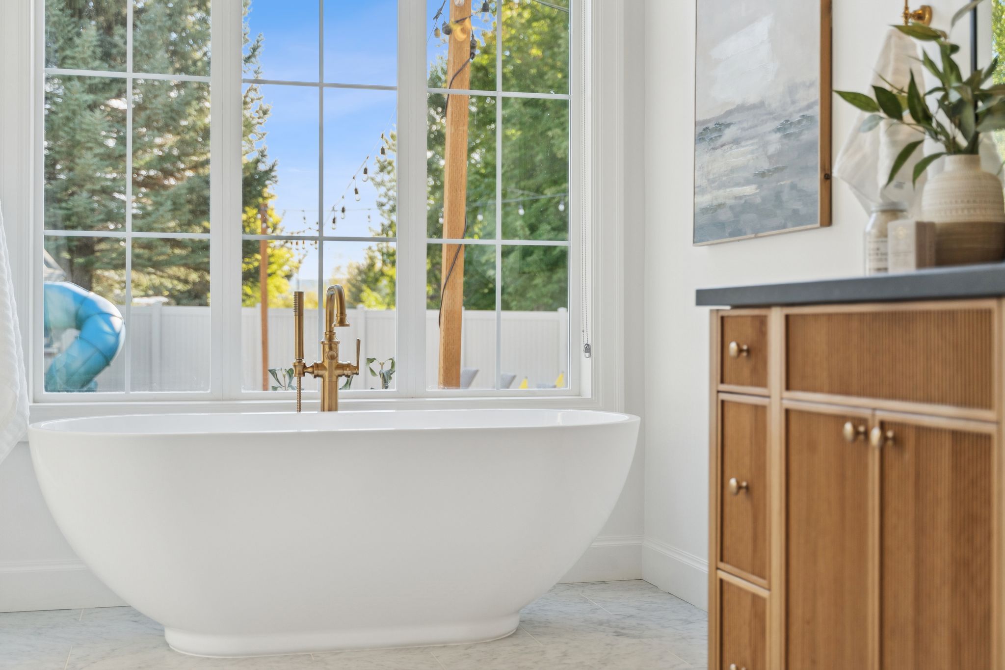Bathroom featuring baseboards and a soaking tub