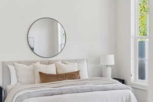 Bedroom featuring multiple windows