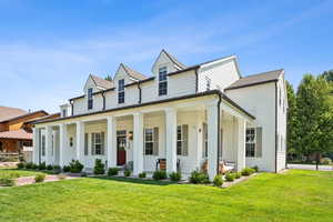 View of front of house with covered porch