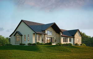 View of front of house with a front yard, a shingled roof, stone siding, and stucco siding