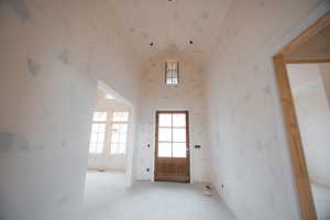 Entryway with plenty of natural light and high vaulted ceiling