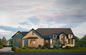 French country home with stone siding, a lawn, and roof with shingles