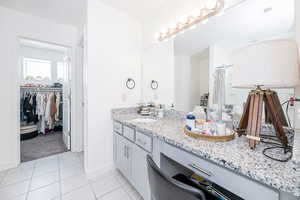 Primary bath vanity with granite countertops