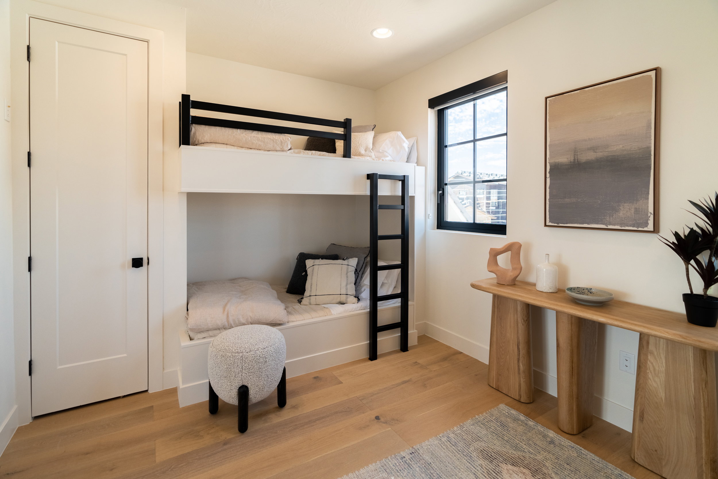 Bedroom with light wood finished floors and recessed lighting